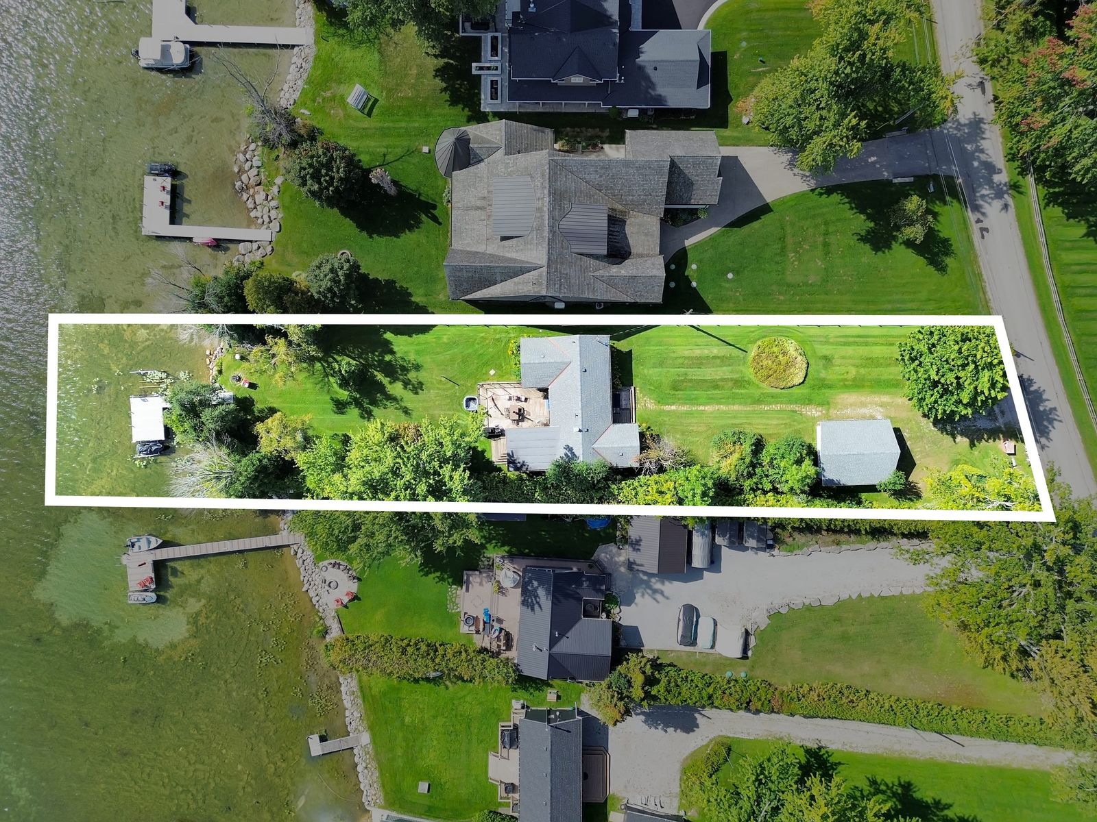 Drone aerial with property-line overlay showing the full lot
