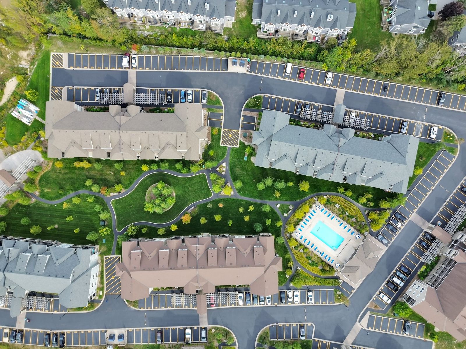 Aerial of a resort-style condo community with pool, Collingwood