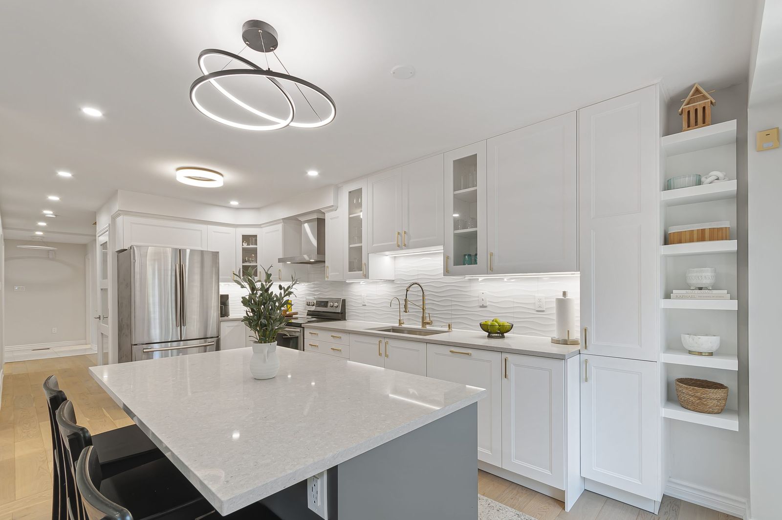 Bright white kitchen with quartz island, York Region