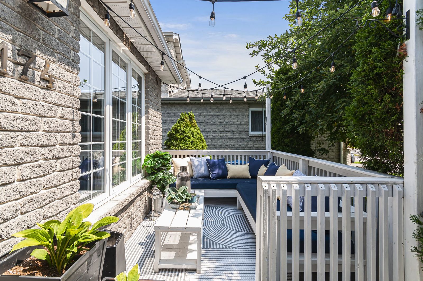 Deck and outdoor lounge with string lights