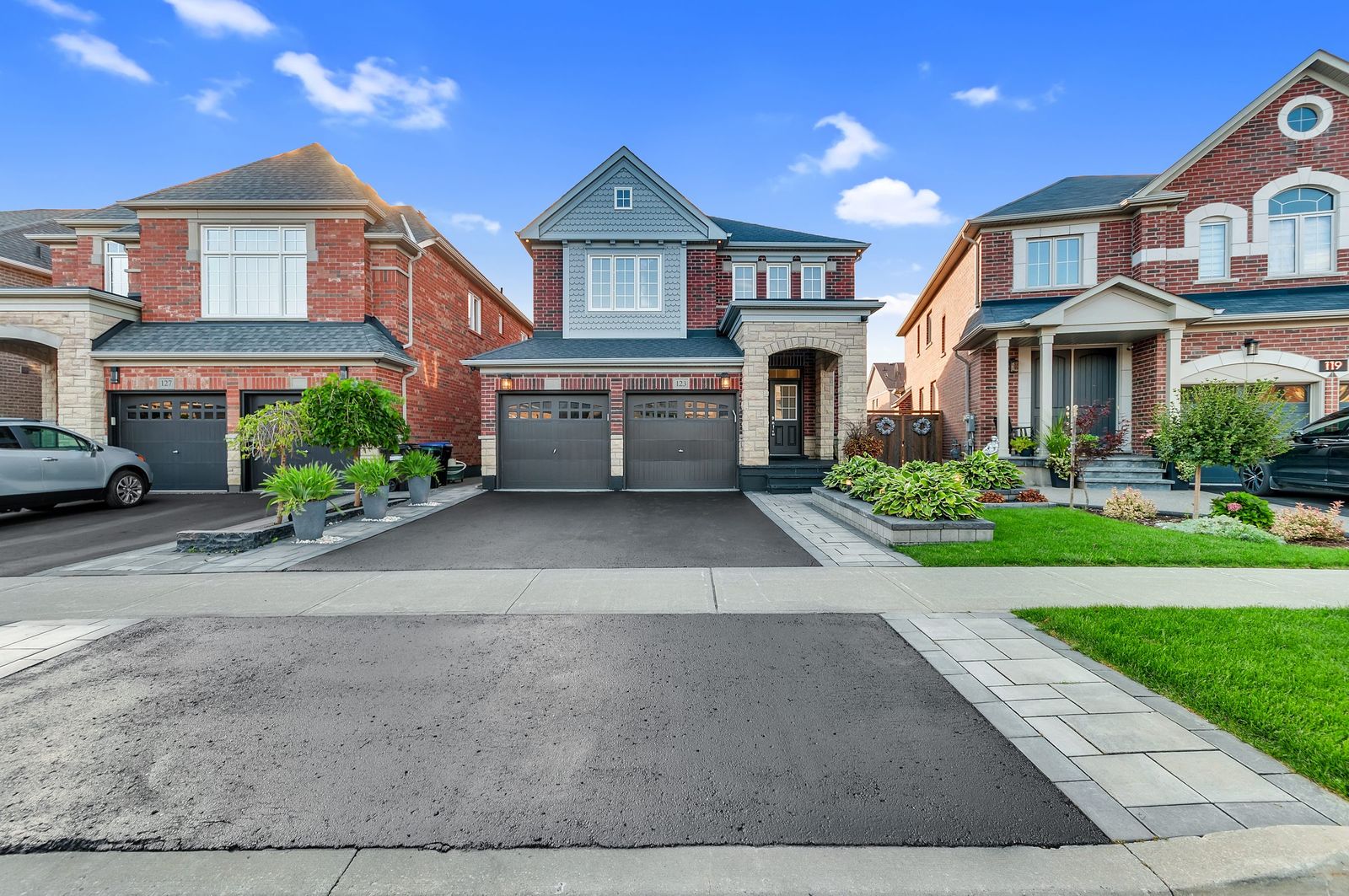 Detached home exterior with wide driveway, York Region