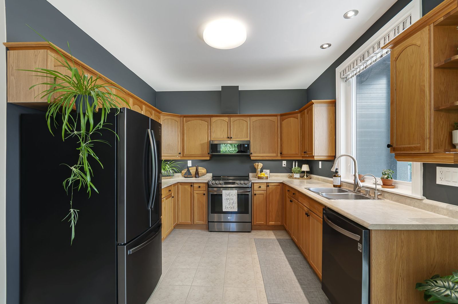 Kitchen with wood cabinetry and full window light