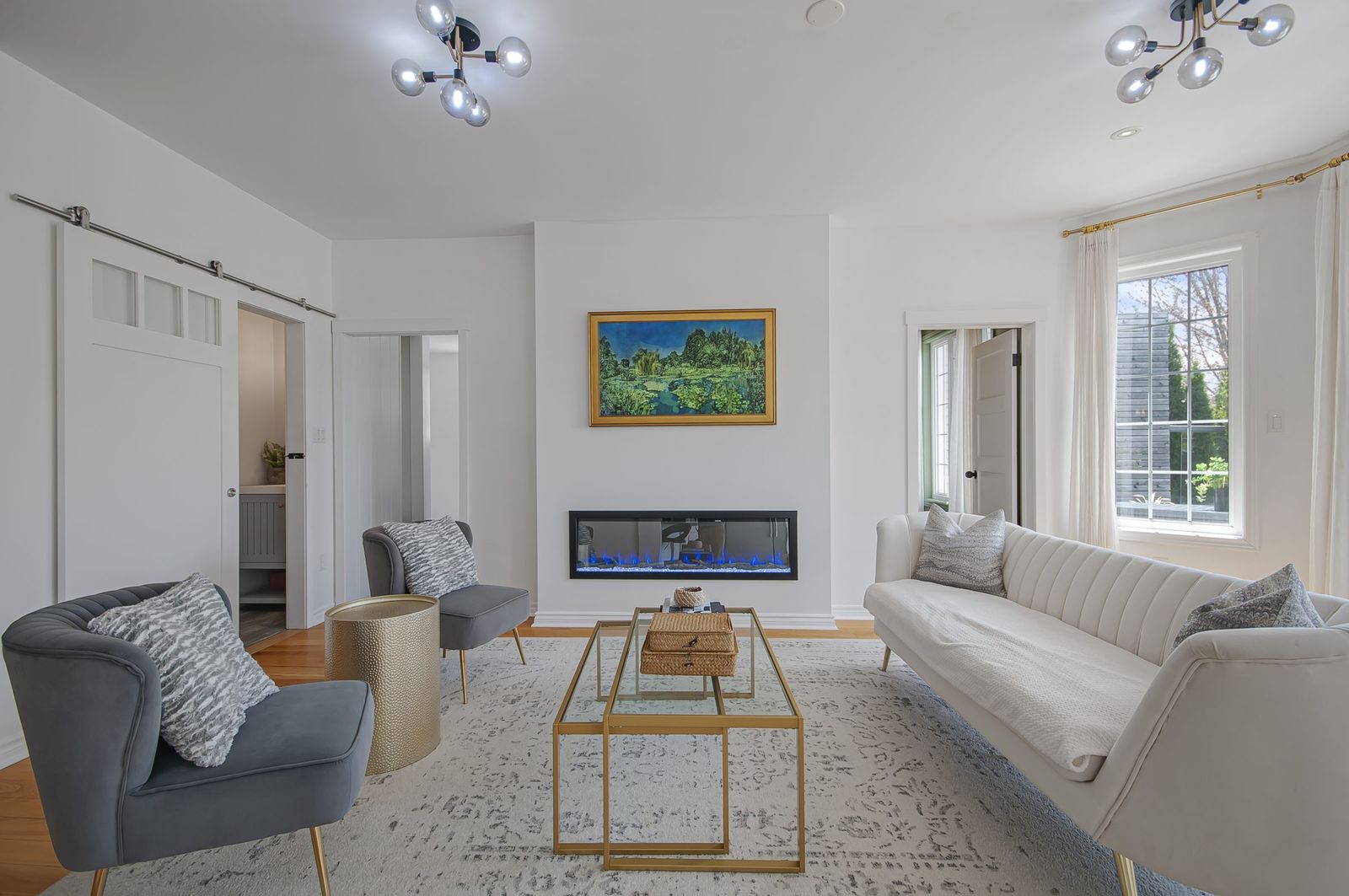 Living room with fireplace and bright windows