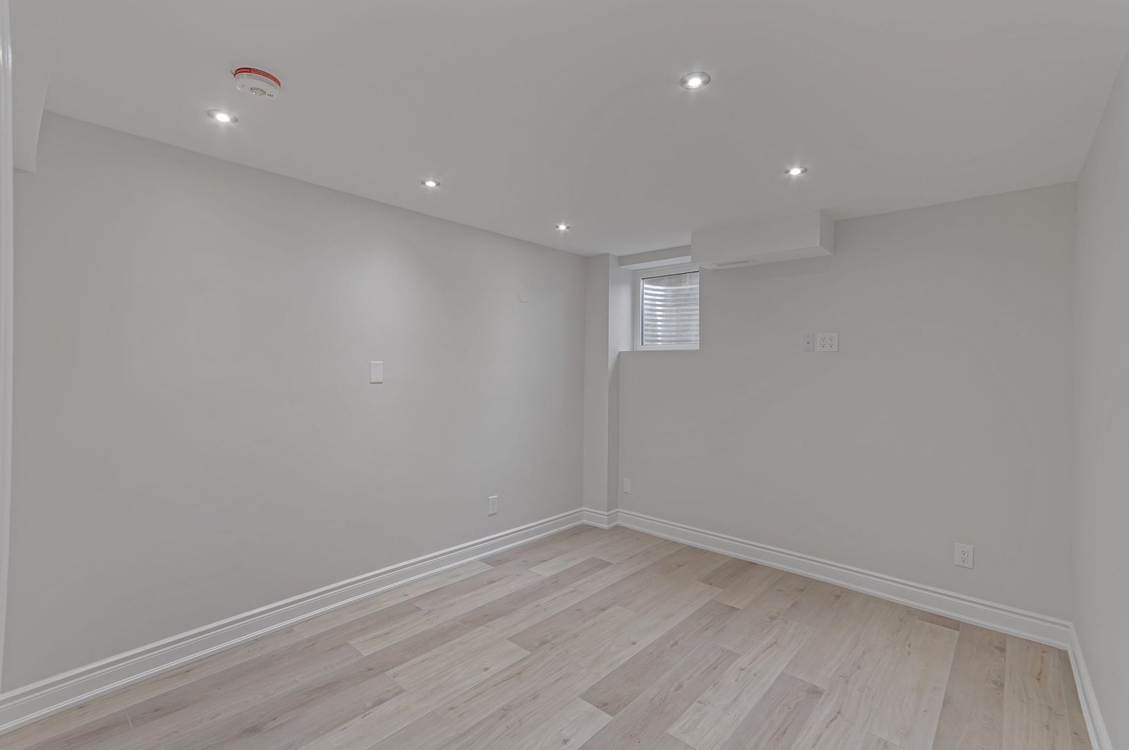 Basement bedroom before virtual staging — empty room, Brampton listing