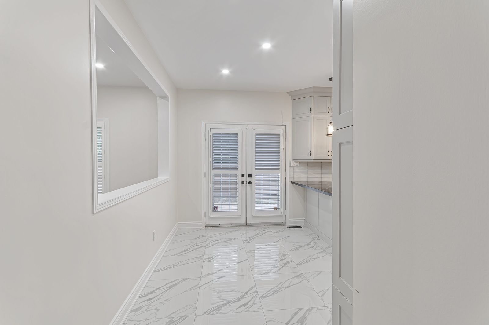 Dining area off the kitchen before virtual staging — empty room, Brampton listing