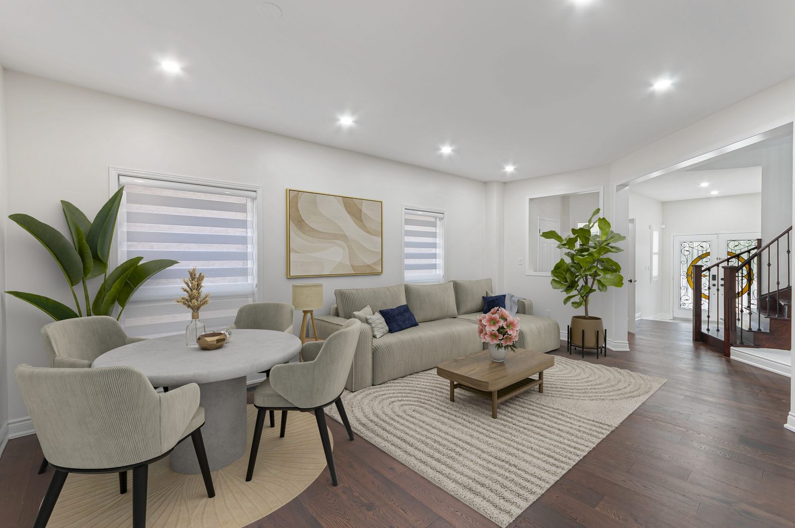 The same living and dining, main floor after virtual staging — furniture and decor added