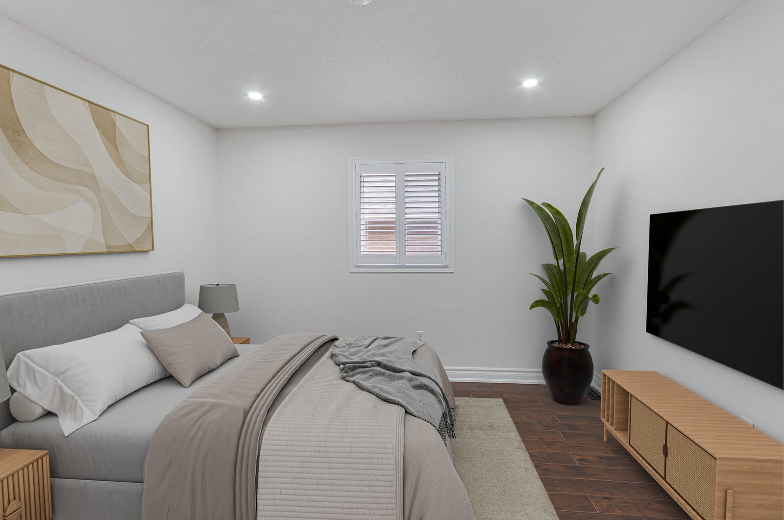 The same bedroom with media wall after virtual staging — furniture and decor added