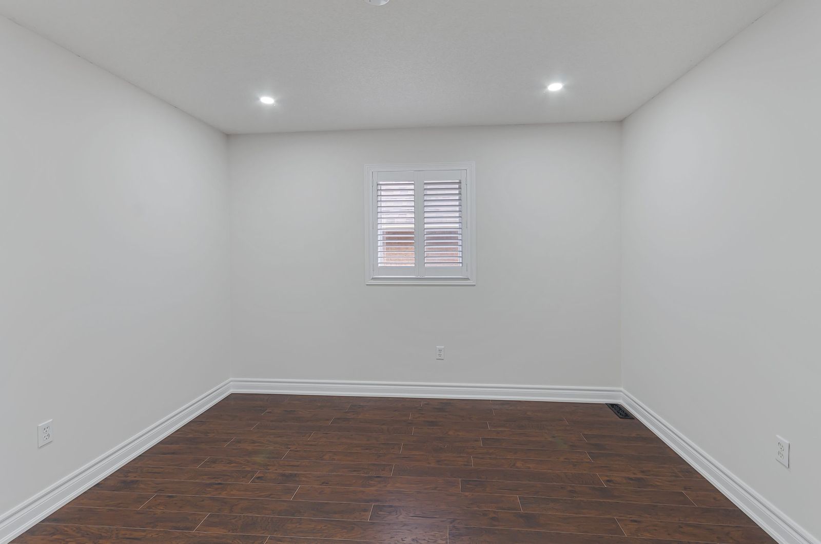 Bedroom with media wall before virtual staging — empty room, Brampton listing