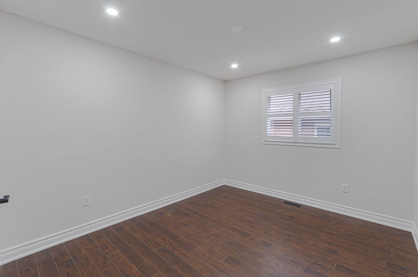 Guest bedroom before virtual staging — empty room, Brampton listing