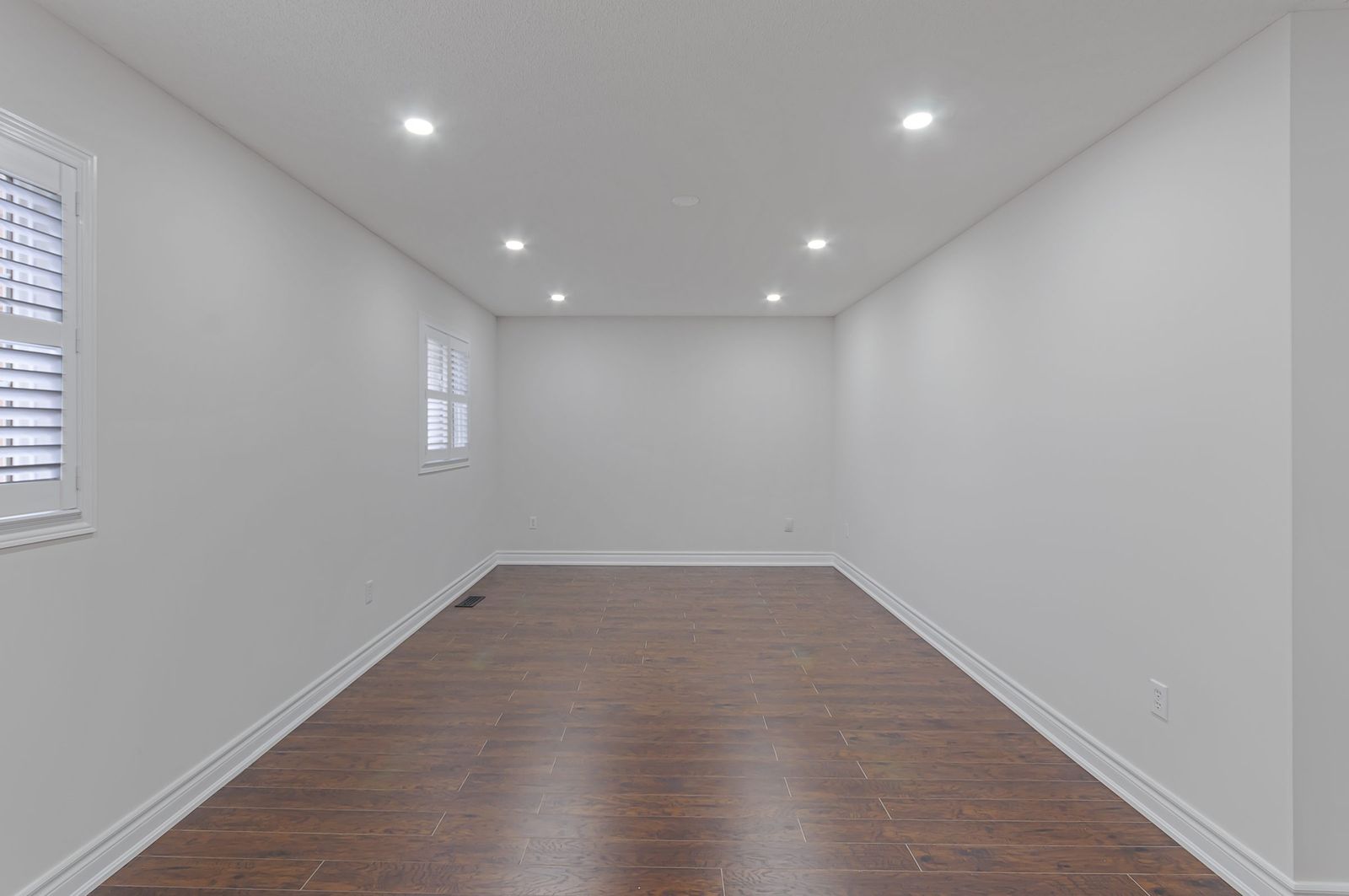 Lower-level bedroom before virtual staging — empty room, Brampton listing