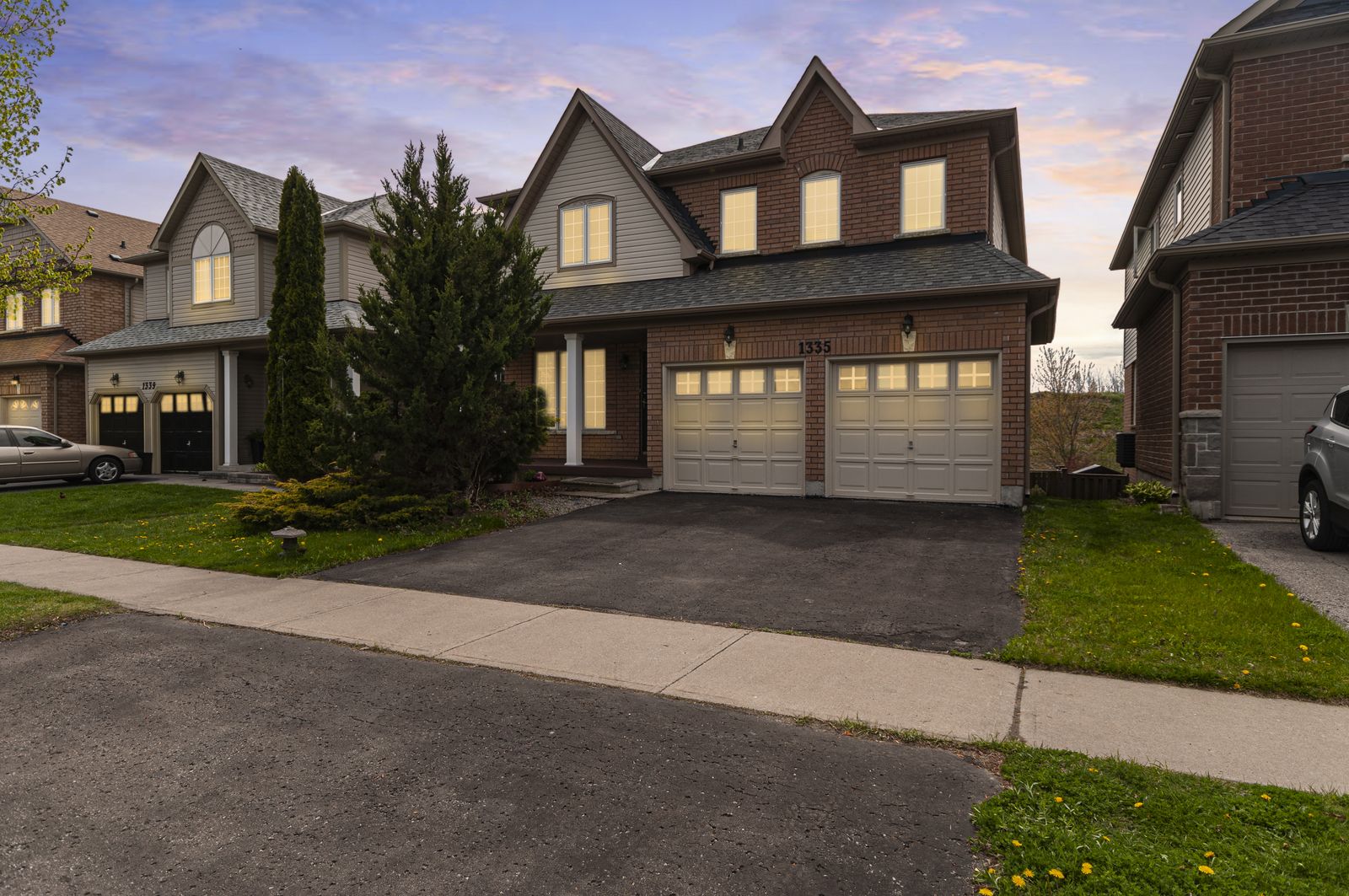 Day-to-dusk conversion of a suburban home with warm window light